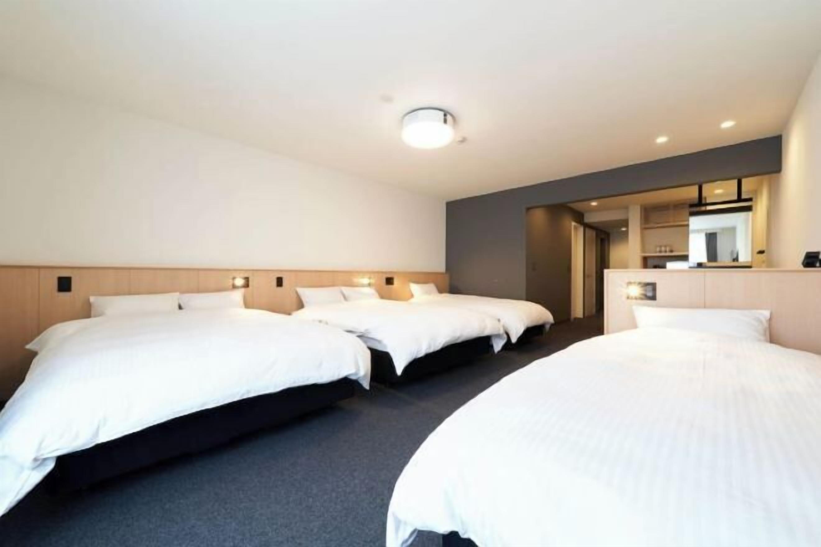 Premium bedding, desk, laptop workspace, blackout curtains