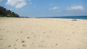A wide sandy beach with a clear sky and scattered clouds. - Lovely Open Plan Family Villa in Kato Katelios (Kefalonia)