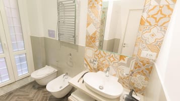 Deluxe Triple Room | Bathroom | Hair dryer, slippers, bidet, towels