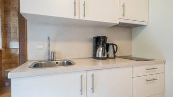 Fridge, stovetop, coffee/tea maker, electric kettle