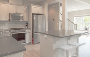 Coffee/tea maker, fridge, microwave, oven