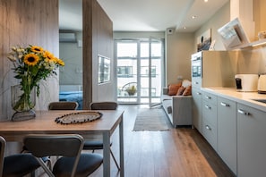 Panoramic Studio Suite | Living area | 40-inch LCD TV with cable channels, TV - Serviced Apartments G11 - between Main Market Square and Jewish Quarter by InPoint (Kraków)