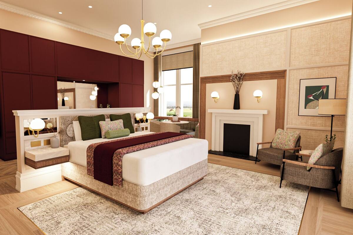 A modern bedroom with a large bed, a fireplace, and a seating area with two armchairs.