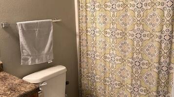 Combined shower/tub, hair dryer, towels, soap