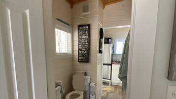 Shower, hair dryer, towels, toilet paper