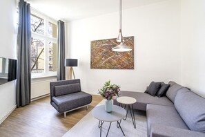 Apartment, 1 Bedroom | Living area | 43-inch Smart TV with digital channels, TV, tablet - BENSIMON apartments Mitte / Wedding (Berlin)
