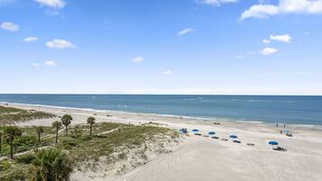 On the beach, sun loungers, beach towels
