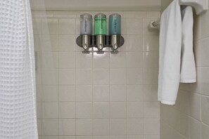 Combined shower/bathtub, hair dryer, towels, soap - REMODELED, immaculately designed, BEACHFRONT condo with gorgeous water views (Madeira Beach)