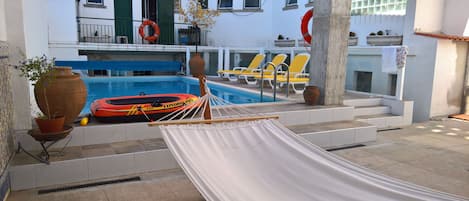 Seasonal outdoor pool, pool loungers