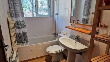 Bathtub, hair dryer, towels, soap