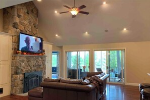 Smart TV, fireplace, table football, books