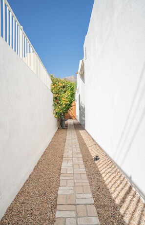 Stroll through the charming alleyway to the entrance of this historic building.