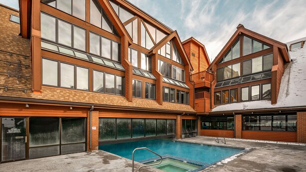 A modern building with large windows and a swimming pool. - Ski-In/Ski-Out Park City Mountain Resort 1BR+Loft Sleeps 6-A/C & Fireplace (Park City)