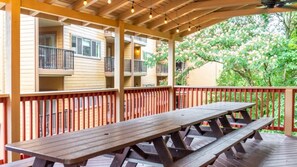 Relax in a serene outdoor space with a picnic table and lush surroundings.