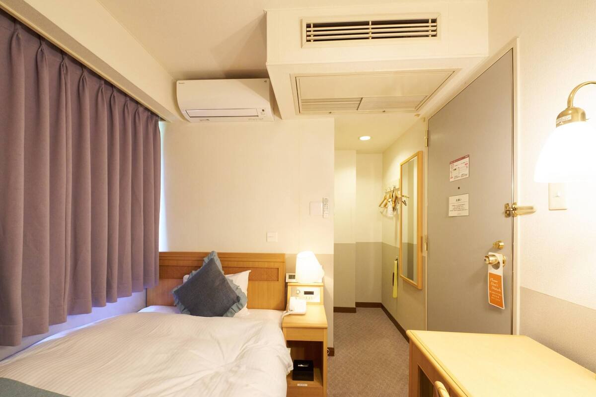 Desk, laptop workspace, free WiFi, bed sheets