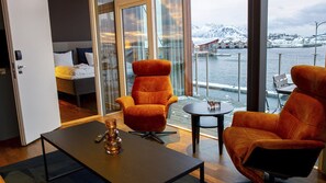 Deluxe Condo | Living area | 55-inch Smart TV with digital channels, TV - Nordis Apartments (Vagan)