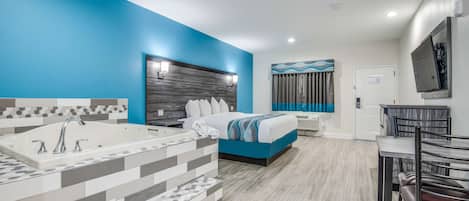Suite, 1 King Bed, Smoking, Jetted Tub | 1 bedroom, desk, laptop workspace, iron/ironing board