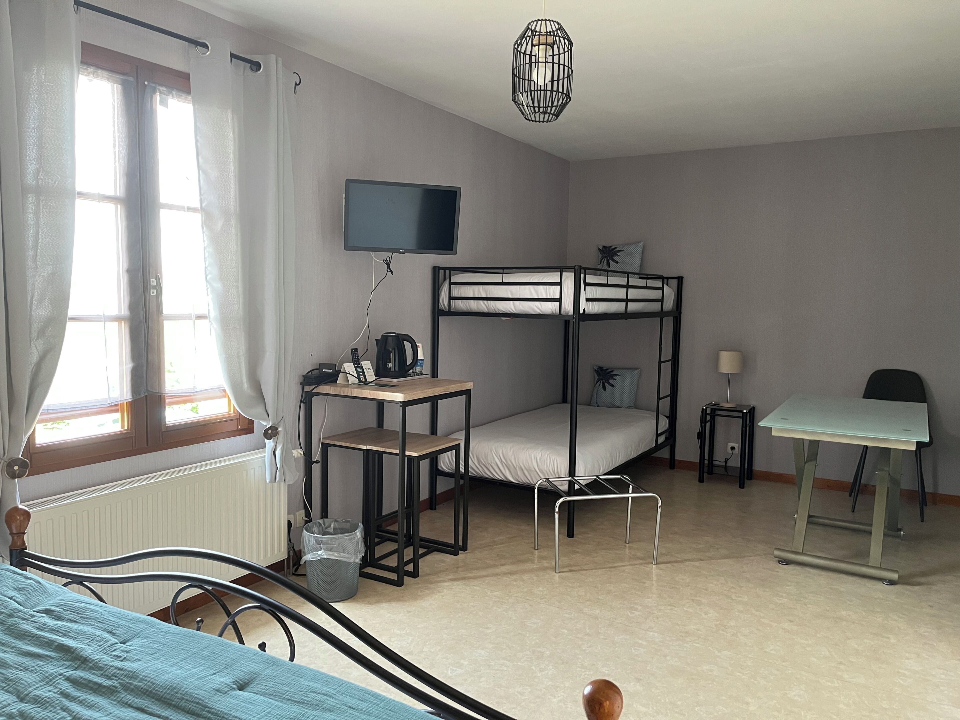 family room | 1 bedroom, individually decorated, individually furnished, desk