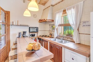 Fridge, microwave, oven, stovetop - Stunning Villa “Sa Sini” with Pool, Garden Air Conditioning & Wi-Fi (BUGER)