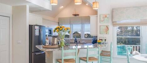 Fridge, stovetop, dishwasher, coffee/tea maker