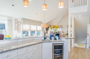 Fridge, stovetop, dishwasher, coffee/tea maker