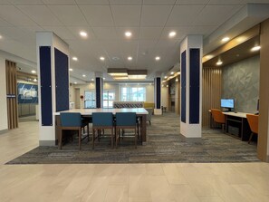 A spacious conference room with a long table, several chairs, and a computer setup. - Holiday Inn Express & Suites Ft. Smith Airport by IHG (Fort Smith)