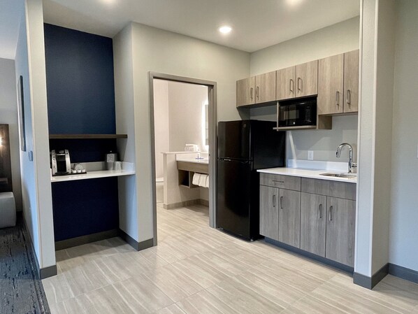 A modern kitchen with a refrigerator, microwave, and sink. - Holiday Inn Express & Suites Ft. Smith Airport by IHG (Fort Smith)
