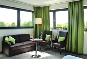 Quarto conforto, sacada | Área de estar | TV de tela plana