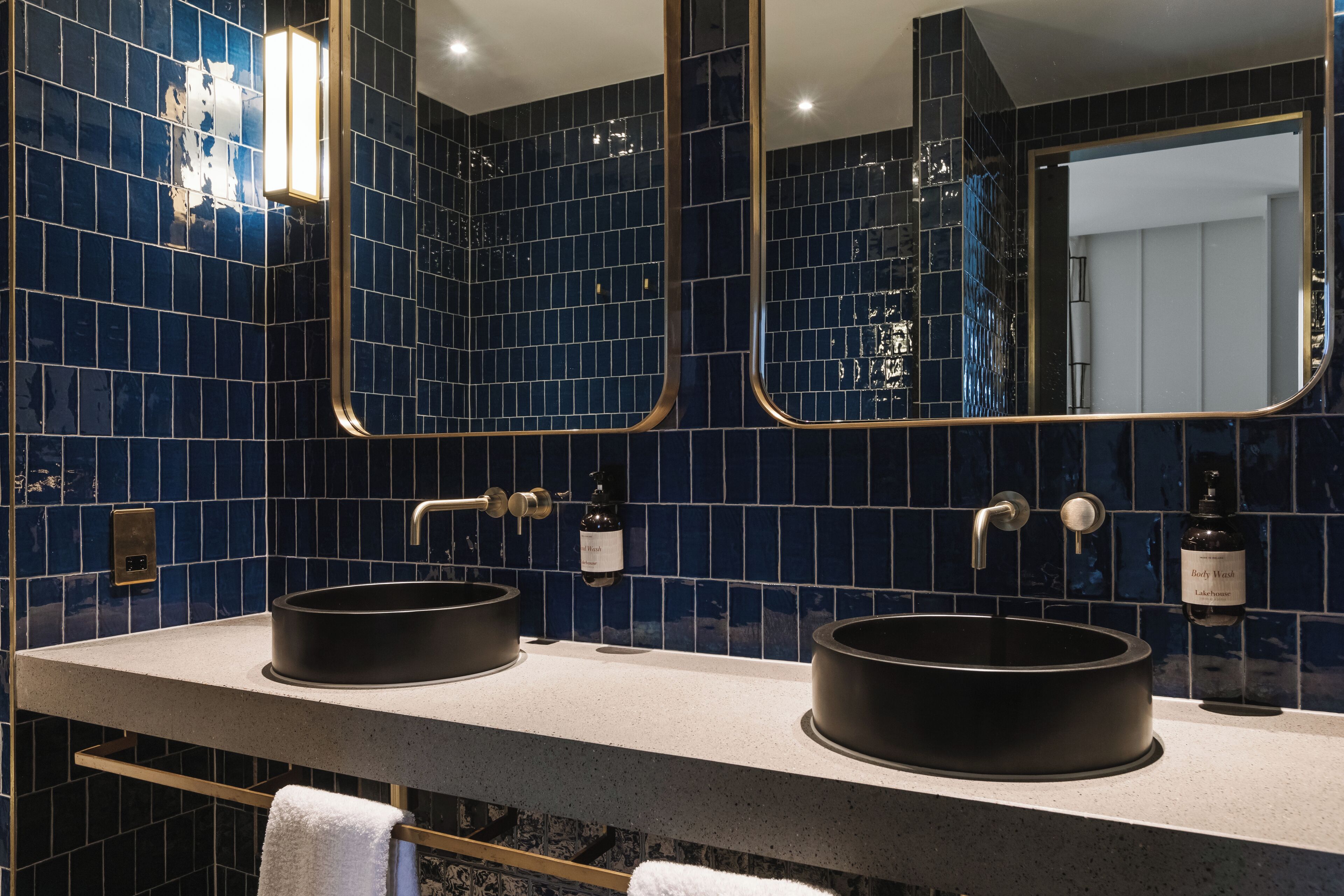 designer toiletries, hair dryer, towels, soap