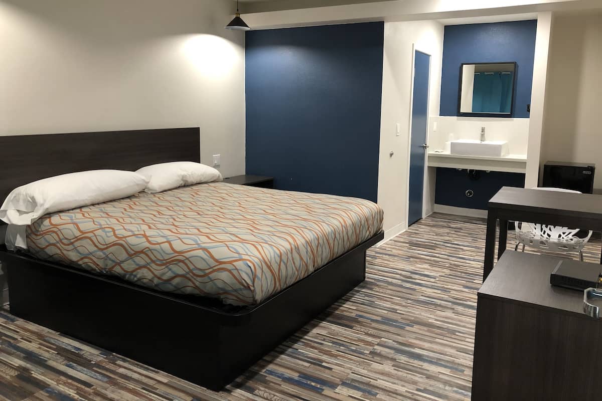 Desk, laptop workspace, WiFi (free), bed sheets