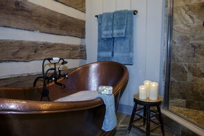 Bathtub, hair dryer, towels, soap