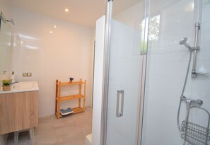 Shower, hair dryer, towels, toilet paper