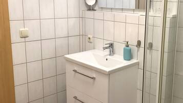 Shower, towels, soap, toilet paper