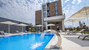 Outdoor pool, pool umbrellas, sun loungers