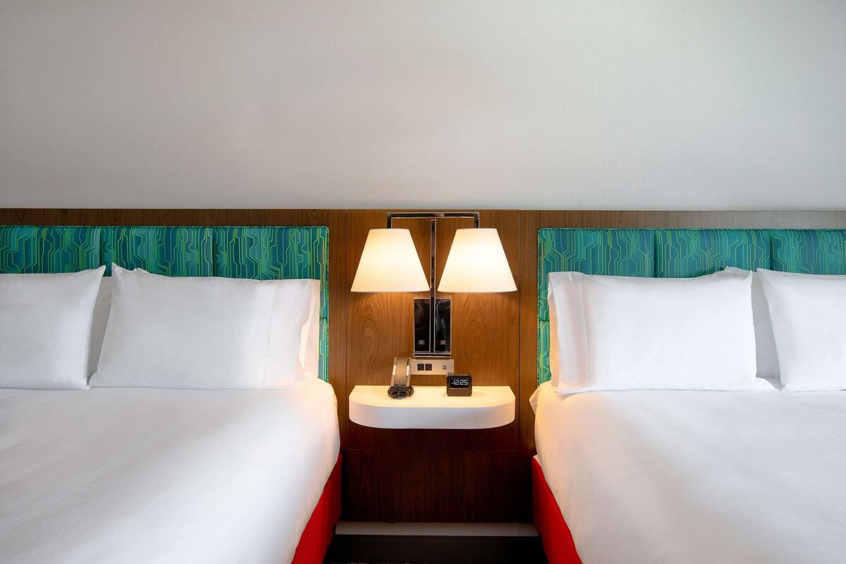 room, 2 queen beds, refrigerator & microwave | in-room safe, desk, free wifi, bed sheets