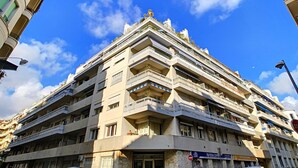 A multi-story building with balconies and a sign indicating a restaurant. - N&J  - BEETHOVEN - Central - Residental area (Niza)