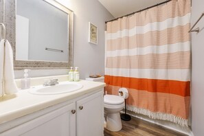 Bathtub, hair dryer, towels, soap