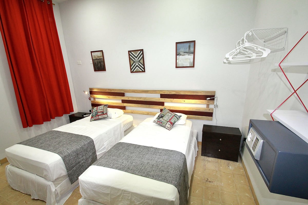 Standard Double Room | Minibar, in-room safe, iron/ironing board, WiFi