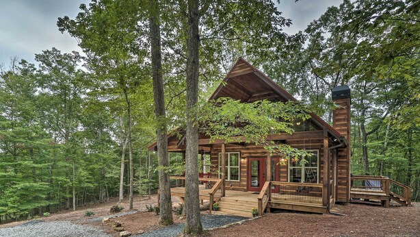 A rustic cabin with a wooden exterior, a front porch, and a chimney. - Peaceful Cabin on 3 Private Acres: Deck & Fire Pit (Blairsville)