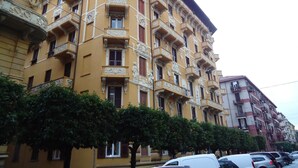 A multi-story building with ornate architectural details, including balconies and decorative moldings. - Le Camere di Teo 2 (La Spezia)