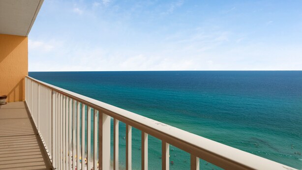 A balcony with a view of the ocean.