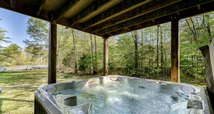 Spacious lakeside home featuring a private cove, hot tub, dock & theater room
