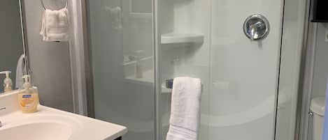 Shower, hair dryer, towels, soap