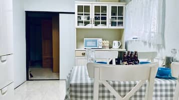 Fridge, microwave, stovetop, cookware/dishes/utensils