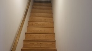 A wooden staircase with a handrail, leading to a door at the top. - Charming House near Gardner Webb (Cliffside)