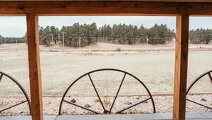 A wooden structure with a view of a dry field and trees. - Tranquil Trailside (Custer)