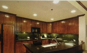 Enjoy cooking in this well-equipped kitchen with a microwave and sink.