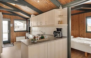 Fridge, stovetop, dishwasher, coffee/tea maker