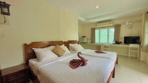 A hotel room with two beds, a desk with a TV, and a window with curtains. - Baan Baramee House (Chiang Rai)