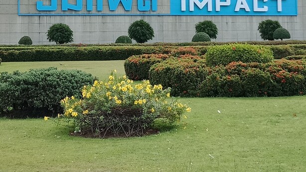 A building with a large sign reading 'SWING IMPACT'. - Comfortable Studio T8 Impact Bangkok Thailand (Pak Kret)